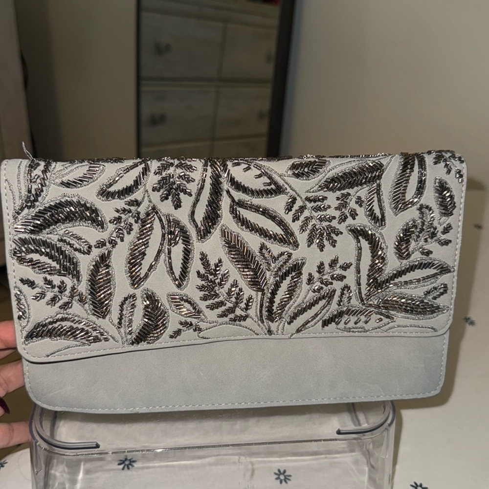 Very cute, gray clutch the perfect amount of sparkle.